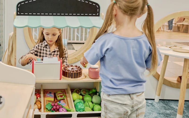 Young girl looking at desserts in a bakery